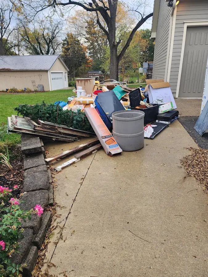 Dumpster being loaded with debris for 3 Yard Dumpster Rental in Merritt Island